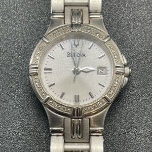 Bulova 96R04 with gemmed bezel, Roman Numerals, and Date Window